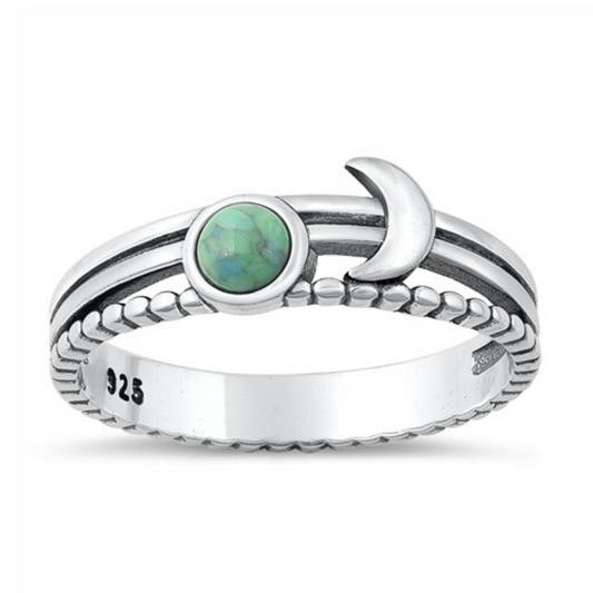 Layered Moon with Turquoise Ring on a white background.