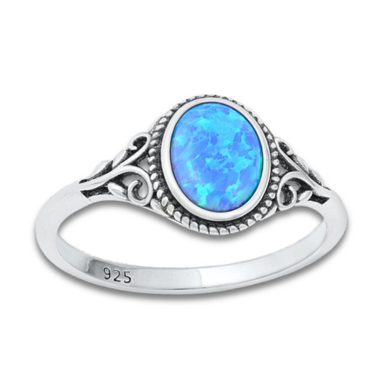 Oval Blue Lab Opal Ring on a white background.