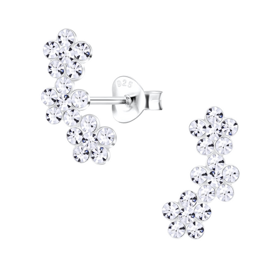 Trail of CZ Flower Earrings on a white background.